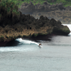 Surfing in Teleng Ria Beach