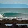 Surfing in Aloneros Beach