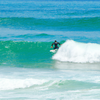 Surfing in Playa de El Brusco