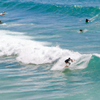 Surfing in Playa de Meron