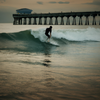 Surfing in Jacksonville Beach Pier