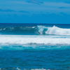 Surfing in Mahaulepu Beach
