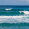 Surfing in Waiohai Beach