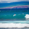 Surfing in Fleming Beach