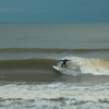 Surfing in Garden City Beach